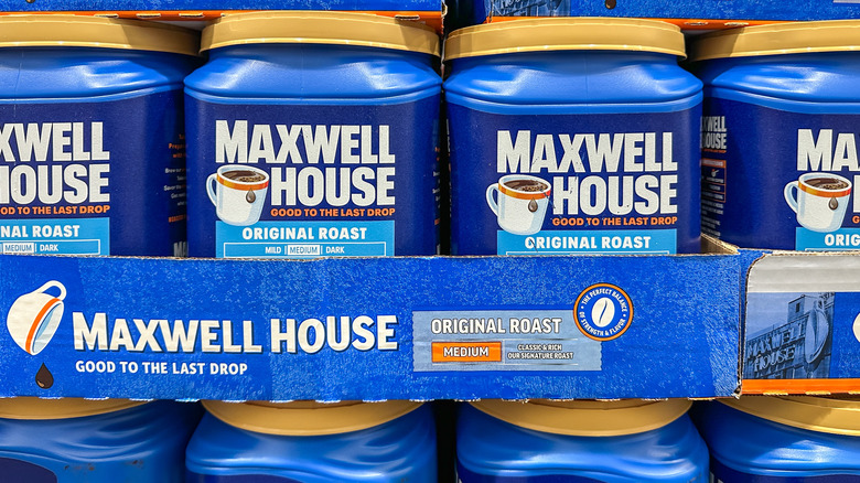 Large cartons of Maxwell House Original Roast Coffee on a shelf at a market