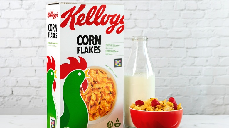 Corn Flakes box, bowl, and milk