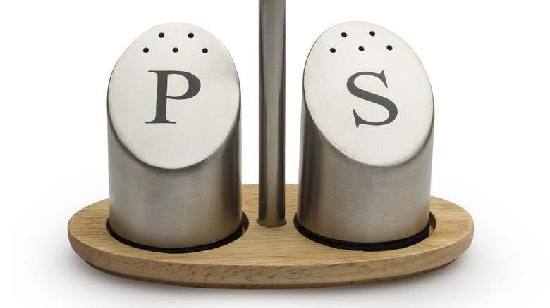 Metal salt and pepper shakers wooden holder