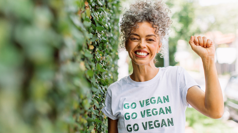 A vegan activist poses for a photo 