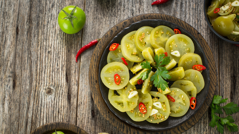 Pickled green tomato slices