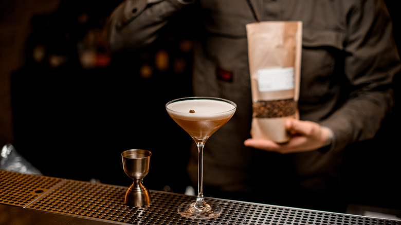 bartender making coffee infused cocktail