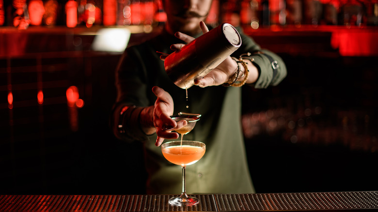 Bartender crafts a cocktail