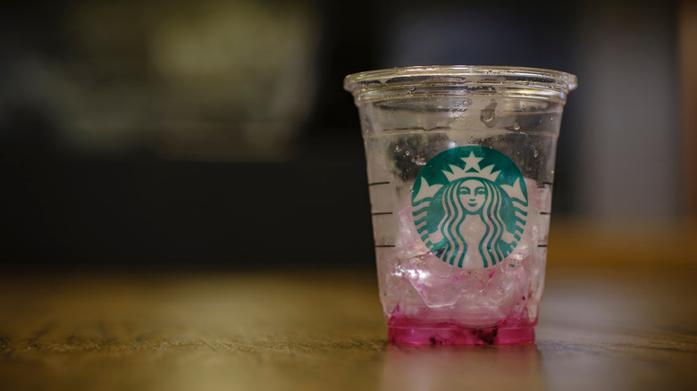 An empty Starbucks refresher cup.