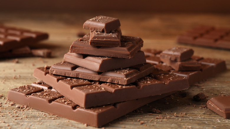 unwrapped chocolate bars and pieces stacked up