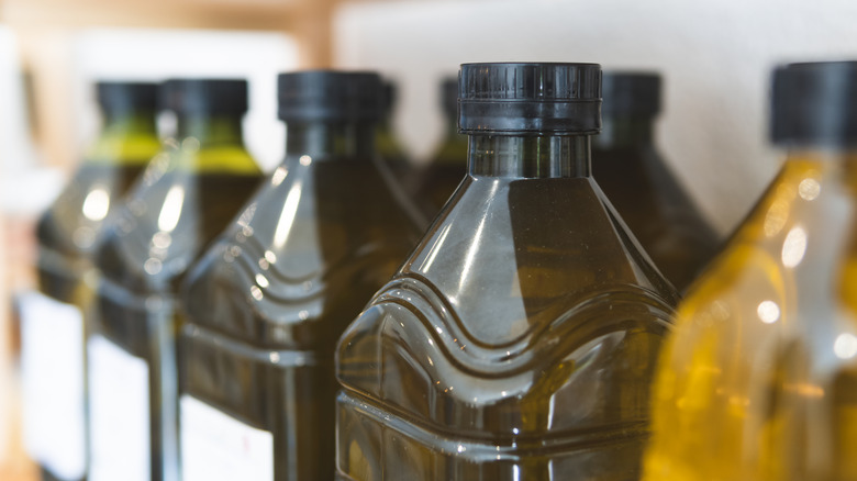 bottles of olive oil on shelf