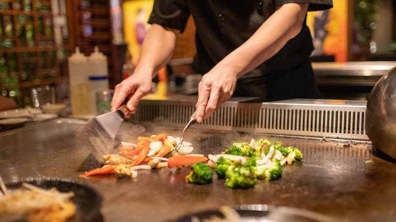 Chef cooking on Teppanyaki grill