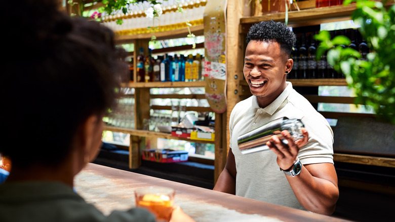 Bartender shaking a cocktail