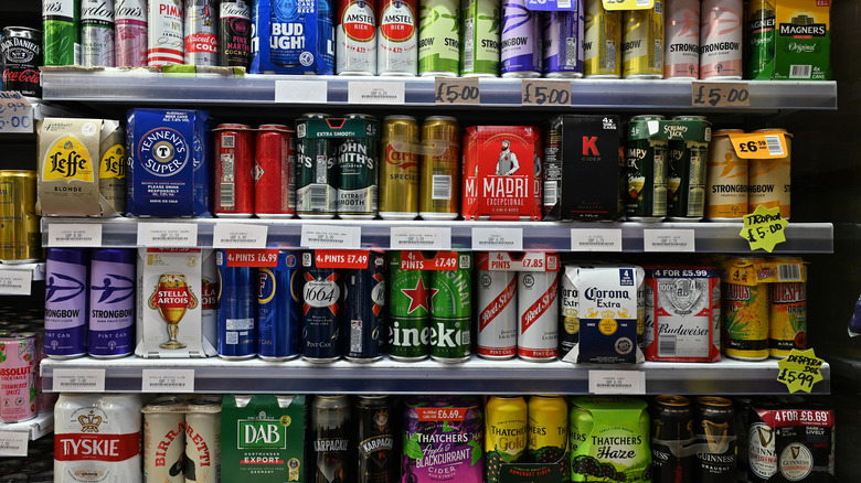 Several rows of a beer aisle at a store