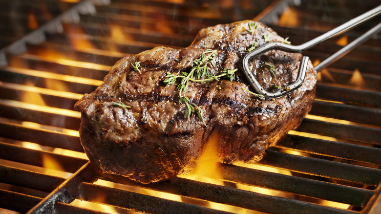 Steak cooking on grill 