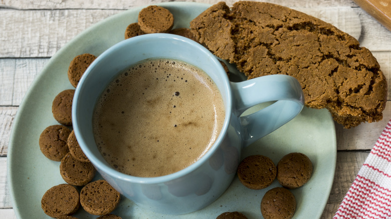 hot beverage in cup with cookies