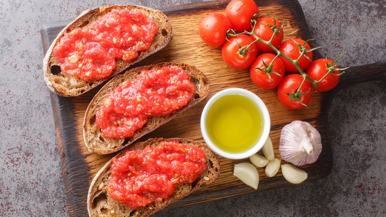 Tomato toasts on wooden board