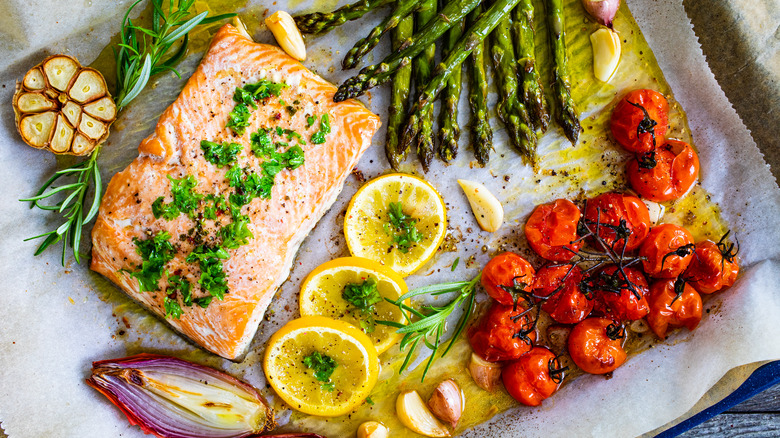 salmon, tomato, asparagus on sheet try