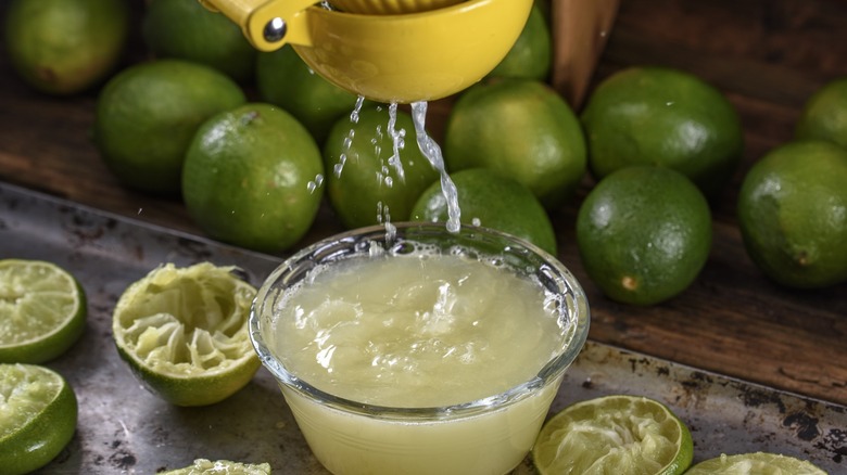 squeezing lime with a juicer