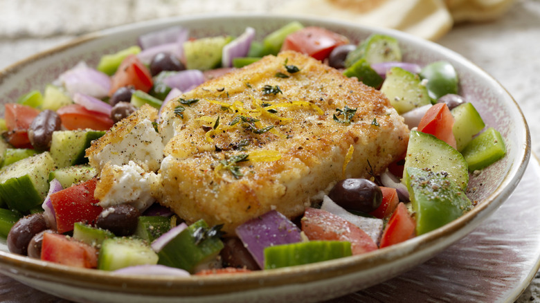 fried feta on greek salad