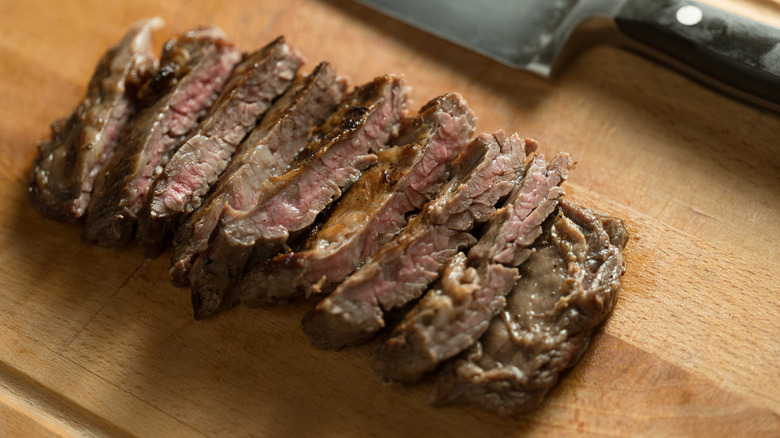 Oven-roasted London broil sliced thin against a cutting board