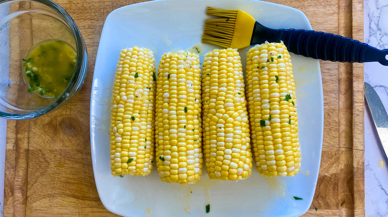 Uncooked corn with garlic butter