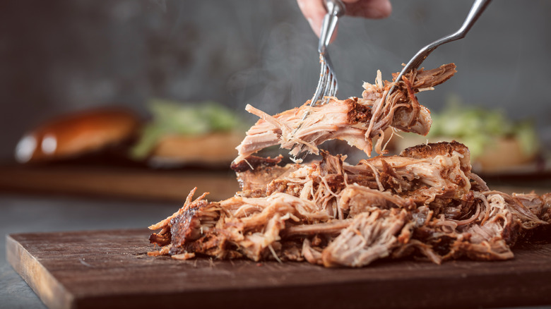 pulled pork being shredded