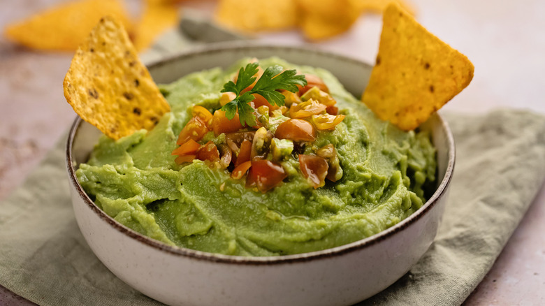 Bowl of guacamole with chips