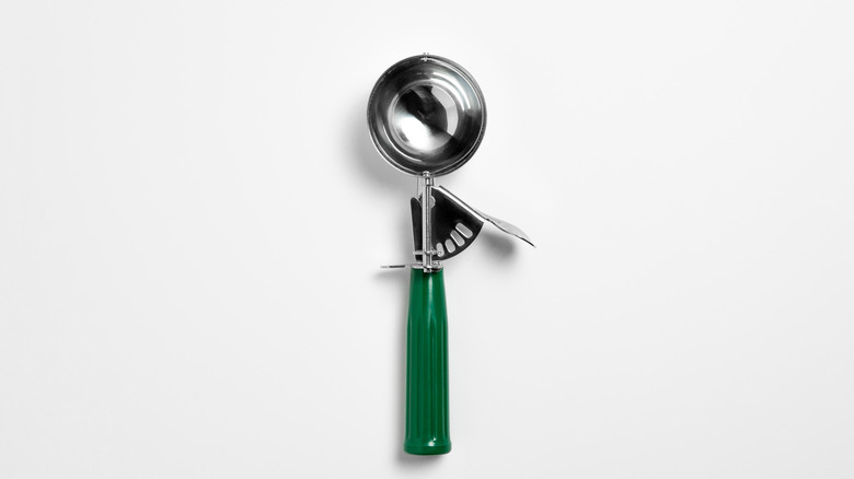 Ice cream scooper with green handle