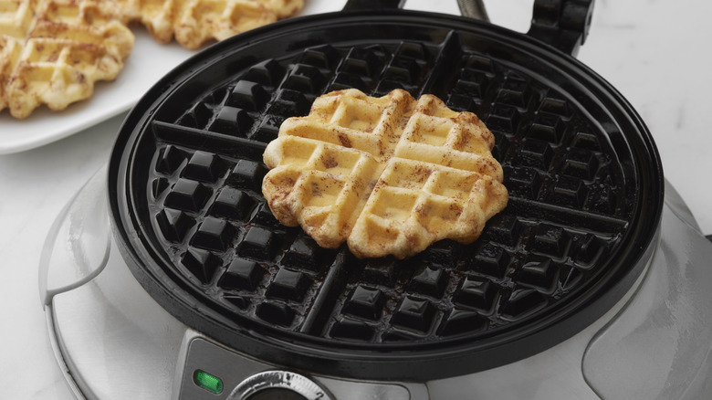 A mini waffle in a waffle iron