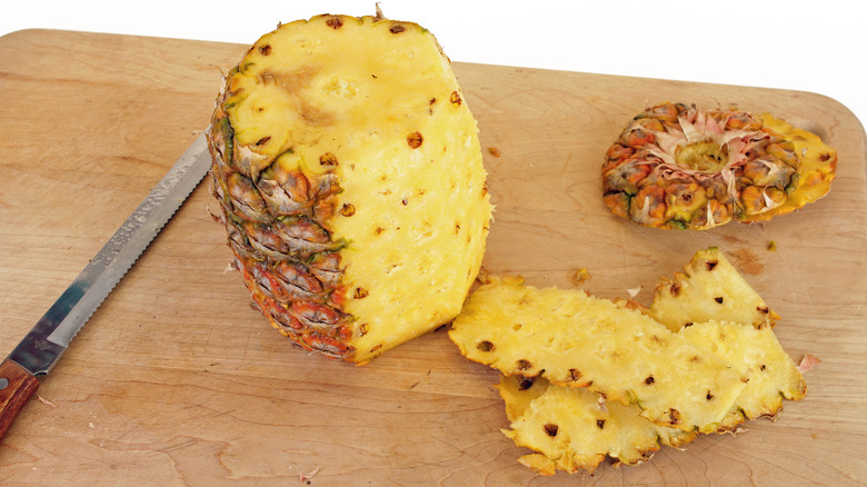 Whole pineapple sliced with serrated knife