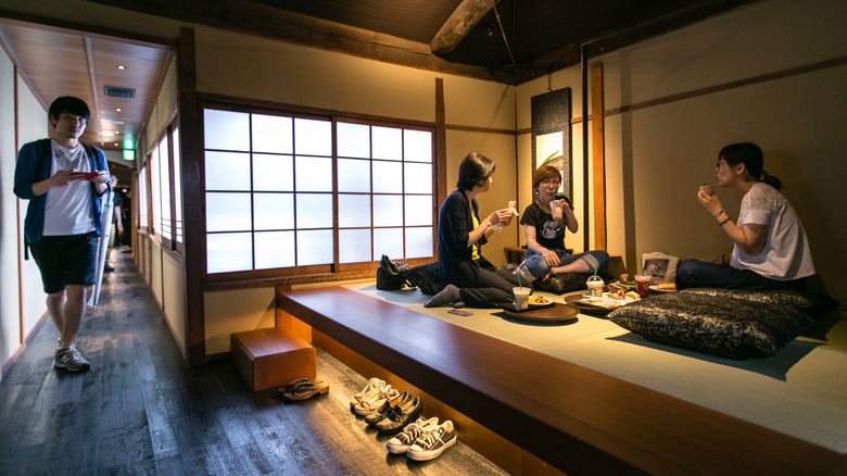 Starbucks customers sitting on ground