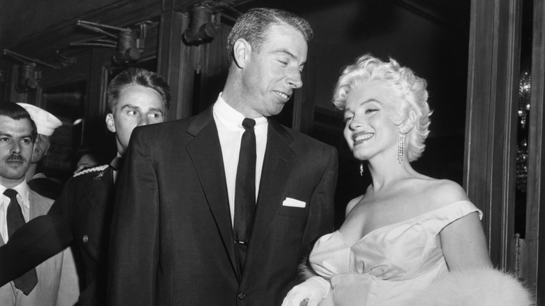 Joe DiMaggio smiling at Marilyn Monroe