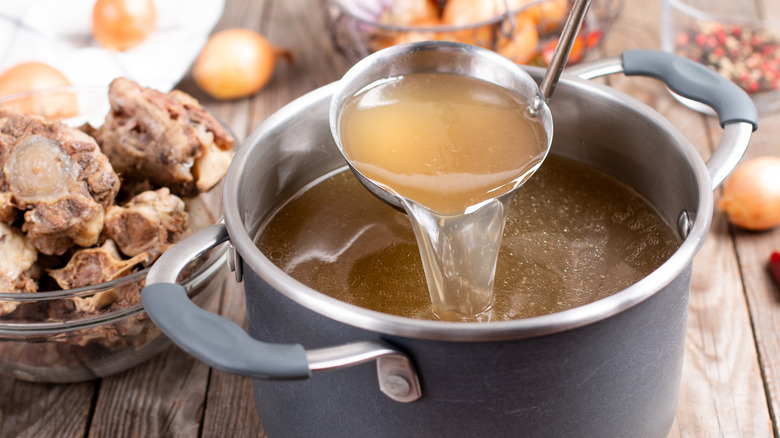 Ladle scooping broth