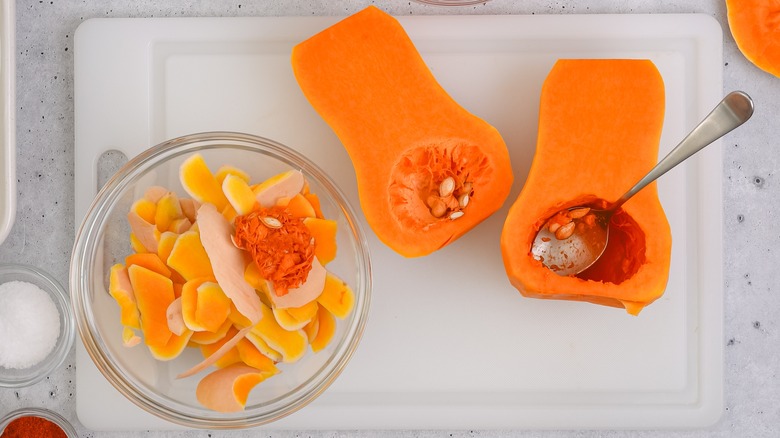 Peeled butternut squash, seeds, and skins