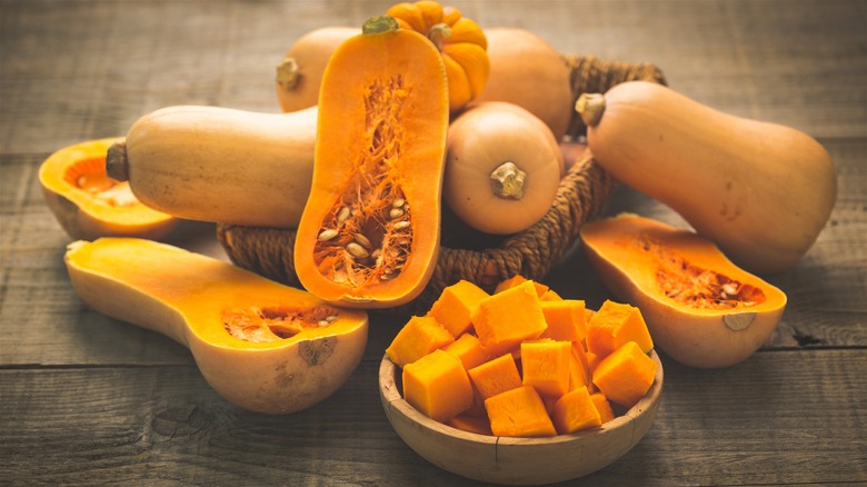 Whole, halved, and cubed butternut squash