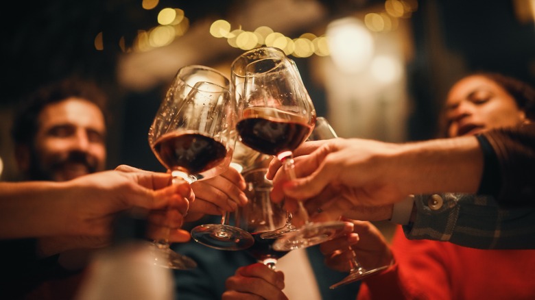 people toasting wine glasses