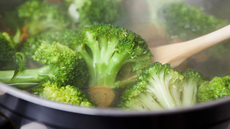 Boiling vegetables in pot 