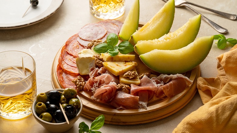 a melon and prosciutto platter