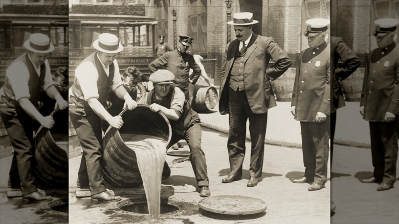 Pouring out barrel sof liquor during Prohibition