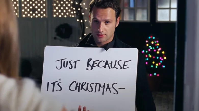 Andrew Lincoln as Mark holding a sign in "Love Actually"