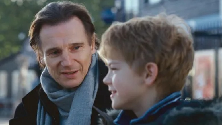 Liam Neeson as Daniel talking to Thomas Brodie-Sangster as Sam in "Love Actually"