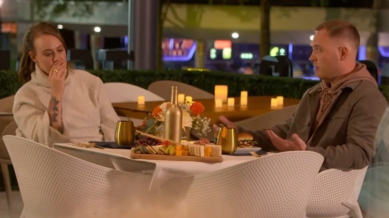 Chelsea and Jimmy sitting at a table in Season 6 of "Love Is Blind"