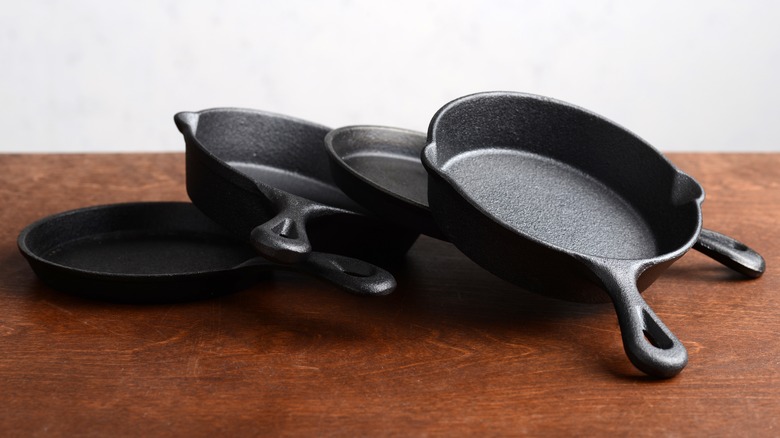 Cast iron skillets on table