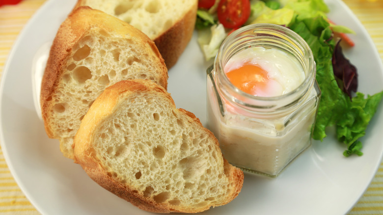 coddled egg in mason jar with baguette