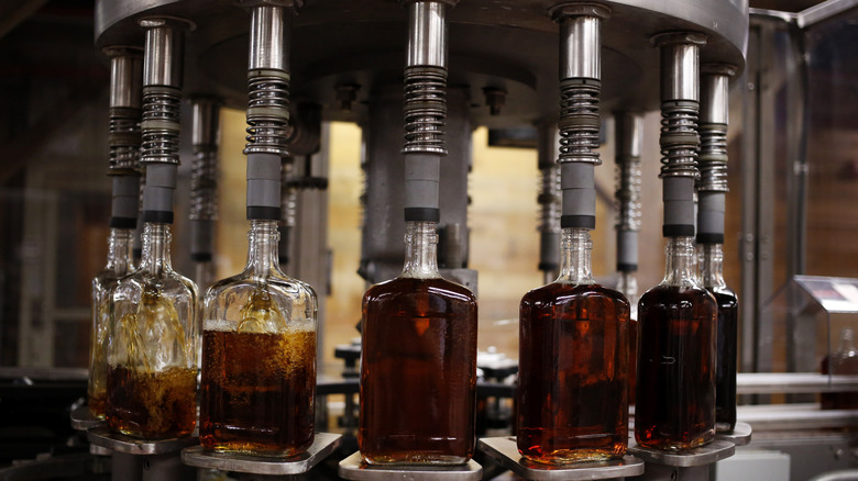 bottling bourbon at a distillery