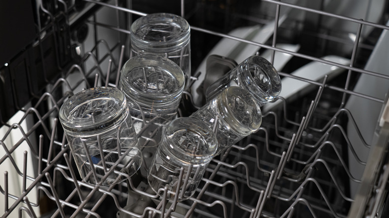 Clear glasses loaded on a dishwasher top rack