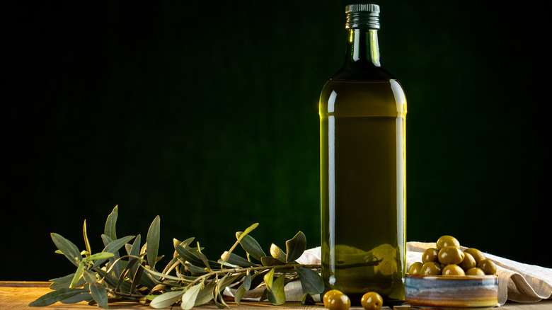 olive oil in green glass