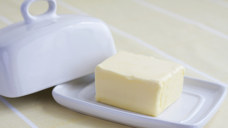 Bar of butter on dish