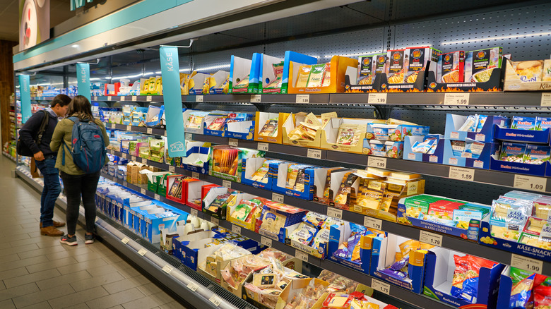 Shoppers in Aldi's cheese section