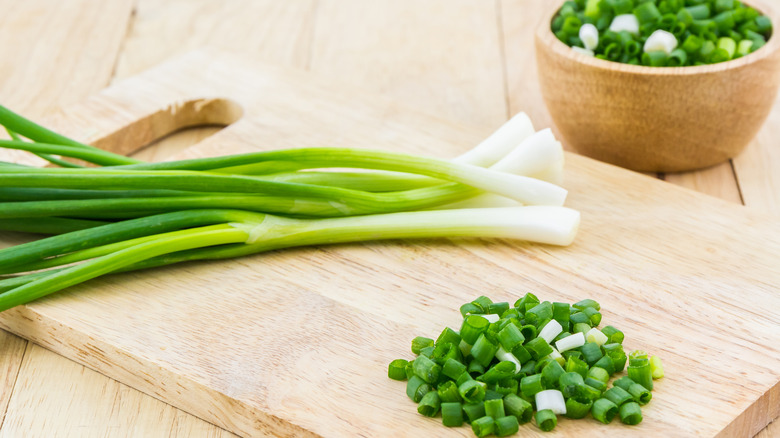 green onions on cutting board