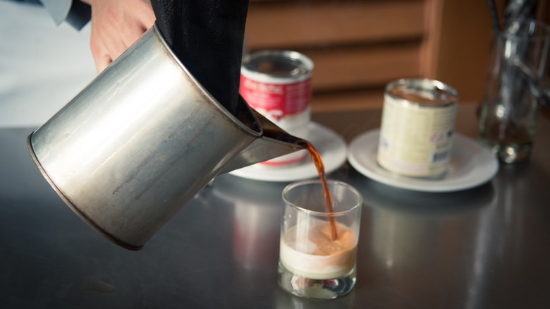 tea being poured into condensed milk