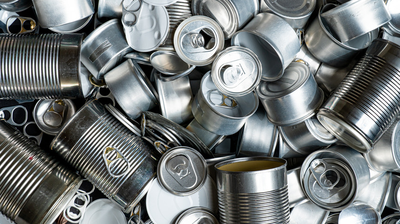 Various opened metal cans