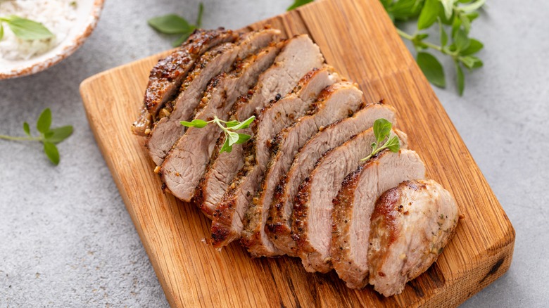 Sliced pork chops on cutting board