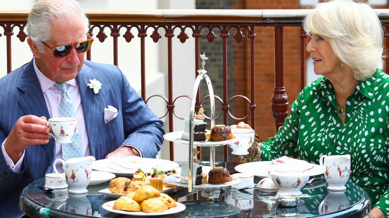 king charles and queen camilla at tea